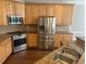 Kitchen features stainless steel appliances and granite countertops at 3709 Valley Pine Ct, Wendell, NC 27591
