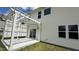 Relax on this backyard deck, with white pergola and hanging lights at 49 W Copenhaver Dr, Clayton, NC 27527