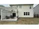 Backyard with a pergola-covered patio featuring outdoor seating and a swing at 49 W Copenhaver Dr, Clayton, NC 27527