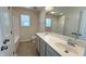 Bathroom features a double vanity, a large mirror, and a bath/shower combination at 49 W Copenhaver Dr, Clayton, NC 27527