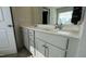 Bathroom with double vanity, updated cabinetry and modern fixtures at 49 W Copenhaver Dr, Clayton, NC 27527