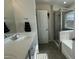 Primary bathroom features a glass enclosed shower, soaking tub and vanity at 49 W Copenhaver Dr, Clayton, NC 27527