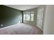 Spacious bedroom features neutral carpeting and paint and natural light at 49 W Copenhaver Dr, Clayton, NC 27527
