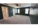 This bedroom boasts a ceiling fan and a walk-in closet with attached open shelves at 49 W Copenhaver Dr, Clayton, NC 27527