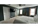 Large primary bedroom with ceiling fan and large windows for natural light at 49 W Copenhaver Dr, Clayton, NC 27527