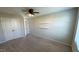 Bedroom features plush carpet, closet, and open shelves offering ample storage at 49 W Copenhaver Dr, Clayton, NC 27527