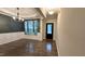 Dining room features hardwood floors, modern light fixtures and views of the front yard at 49 W Copenhaver Dr, Clayton, NC 27527