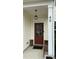 Inviting front entrance with a stylish door, decorative window, and charming porch light at 49 W Copenhaver Dr, Clayton, NC 27527