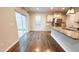 Eat-in kitchen boasts stainless appliances, granite counters, and a sliding glass door that leads to the backyard at 49 W Copenhaver Dr, Clayton, NC 27527