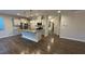 Modern kitchen with stainless steel appliances, granite counters, island with sink, and custom cabinetry at 49 W Copenhaver Dr, Clayton, NC 27527