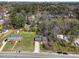 Aerial view of a home surrounded by lush greenery and mature trees at 5108 Melbourne Rd, Raleigh, NC 27606