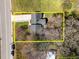Aerial view of house with an estimated property line in a serene setting at 5108 Melbourne Rd, Raleigh, NC 27606