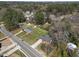 Aerial view of property and neighborhood with mature trees and landscaping at 5108 Melbourne Rd, Raleigh, NC 27606