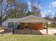 Backyard featuring a covered patio, screened porch, and fenced yard at 5108 Melbourne Rd, Raleigh, NC 27606