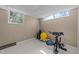 Finished basement featuring an in-home gym with stationary bike and space for workout equipment at 5108 Melbourne Rd, Raleigh, NC 27606