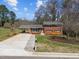 Charming brick home with well-maintained landscaping, a carport, and a long driveway at 5108 Melbourne Rd, Raleigh, NC 27606