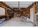 Spacious unfinished garage with concrete floors, exposed beams, and plenty of storage space at 5108 Melbourne Rd, Raleigh, NC 27606