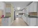 Spacious kitchen with white cabinets, stainless steel appliances, and tile backsplash at 5108 Melbourne Rd, Raleigh, NC 27606