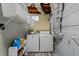 Spacious laundry room with modern washer, dryer, and open shelving for storage at 5108 Melbourne Rd, Raleigh, NC 27606