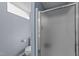 Bright bathroom features a frosted glass shower door and blue walls at 5108 Melbourne Rd, Raleigh, NC 27606