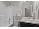 Bright bathroom featuring a shower-tub combo, sleek vanity with stylish hardware, and neutral color palette at 517 Aronia Dr, Hillsborough, NC 27278