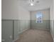 Serene bedroom featuring wainscoting accent wall, carpet floors, and ample natural light at 517 Aronia Dr, Hillsborough, NC 27278