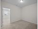 Empty bedroom with carpet, natural light and door leading to another room at 517 Aronia Dr, Hillsborough, NC 27278