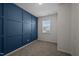 Cozy bedroom with striking blue accent wall and natural light from the window at 517 Aronia Dr, Hillsborough, NC 27278
