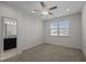 Neutral bedroom with a ceiling fan and a window that provides plenty of natural light at 517 Aronia Dr, Hillsborough, NC 27278