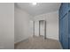 Comfortable bedroom with neutral carpet, blue accent wall, and open closet at 517 Aronia Dr, Hillsborough, NC 27278