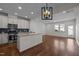 Open-concept kitchen with stainless steel appliances and an island overlooking the breakfast area at 517 Aronia Dr, Hillsborough, NC 27278