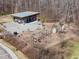 Aerial view of playground with swing sets and climbing structures, picnic shelter and landscaping, in a park-like setting at 517 Aronia Dr, Hillsborough, NC 27278