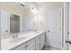 Bright bathroom featuring double sinks, lots of counter space, and neutral decor at 525 Fallon Grove Way, Raleigh, NC 27608