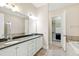 Elegant bathroom featuring double vanity, soaking tub, and walk-in closet at 525 Fallon Grove Way, Raleigh, NC 27608
