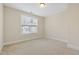 Neutral bedroom with carpet and a window at 525 Fallon Grove Way, Raleigh, NC 27608