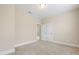 Bedroom featuring carpet, a window, and double closet doors at 525 Fallon Grove Way, Raleigh, NC 27608