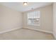 Bedroom with carpet and a window at 525 Fallon Grove Way, Raleigh, NC 27608