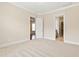 Spacious bedroom showing carpeted floor, adjoining rooms and natural light at 525 Fallon Grove Way, Raleigh, NC 27608