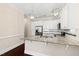 Spacious kitchen island with granite countertops, stainless steel appliances, and white cabinetry at 525 Fallon Grove Way, Raleigh, NC 27608