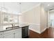 Kitchen island features granite countertops, a stainless steel dishwasher, and modern pendant lighting at 525 Fallon Grove Way, Raleigh, NC 27608