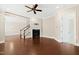 Spacious living room with fireplace, hardwood floors, and staircase at 525 Fallon Grove Way, Raleigh, NC 27608