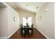 Dining room featuring hardwood floors and bright lighting fixtures at 5513 Edgebury Rd, Raleigh, NC 27613