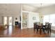 Dining room with a vaulted ceiling, chandelier and modern dark wood table and chairs with hardwood floors throughout at 5513 Edgebury Rd, Raleigh, NC 27613