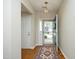 Entryway featuring hardwood floors, an ornate rug, and bright lighting at 5513 Edgebury Rd, Raleigh, NC 27613