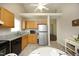 Charming kitchen with light wood cabinets, granite countertops, and stainless steel appliances at 5513 Edgebury Rd, Raleigh, NC 27613