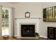 Living room with a fireplace, hardwood floors and a television at 5513 Edgebury Rd, Raleigh, NC 27613