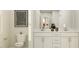 Clean bathroom featuring a double sink vanity with white cabinets and modern fixtures at 712 Swim Cave Ln, Wendell, NC 27591