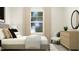 Cozy bedroom featuring a comfortable bed, dresser, and a chair near the window for relaxation at 712 Swim Cave Ln, Wendell, NC 27591