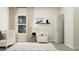 Comfortable Bedroom featuring a white crib, an armchair, and a window with soft, natural light at 712 Swim Cave Ln, Wendell, NC 27591