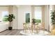Inviting dining area with a round table, comfortable seating, and elegant décor at 712 Swim Cave Ln, Wendell, NC 27591